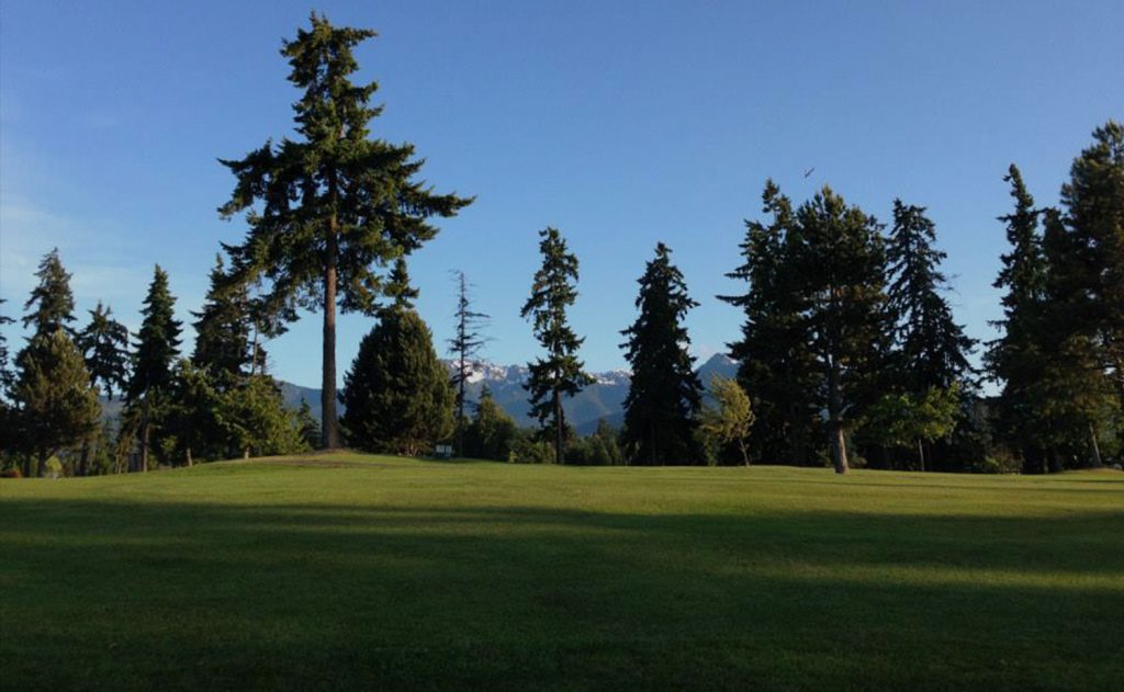 Peninsula Golf Club fairway with Olympic Mountains in the background near Port Angeles Washington